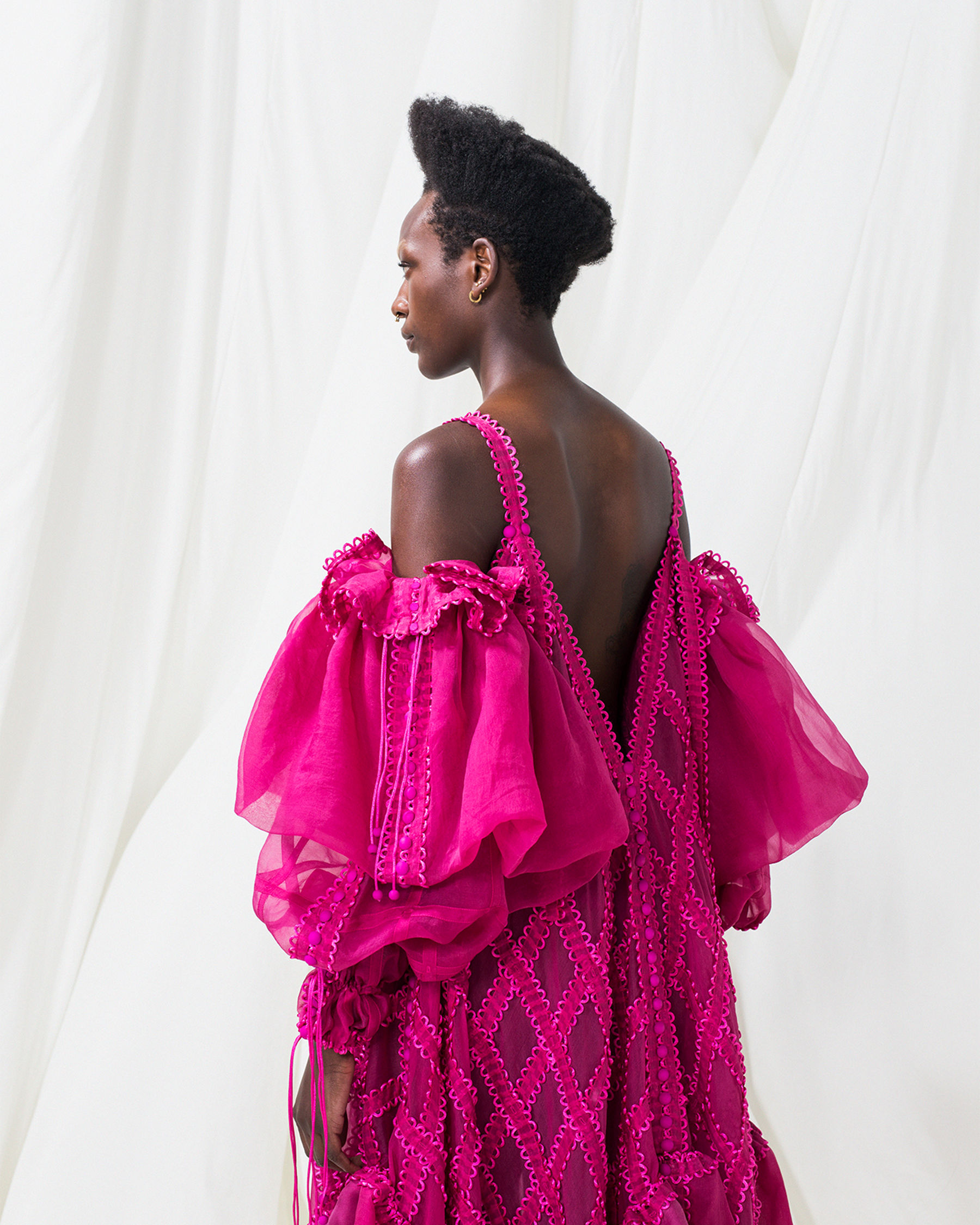 Bright pink modular dress on a model.