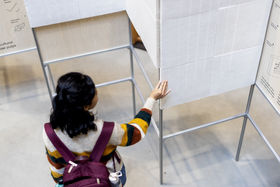 A person exploring Circular Panels exhibition.